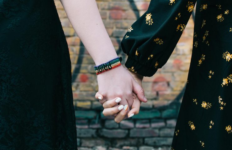 loseup-of-two-female-lgbt-gay-couple-holding-hands-SUH5M4E.jpg